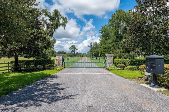 view of gate with fence