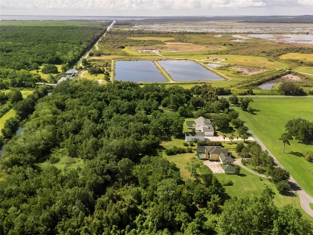 drone / aerial view featuring a water view and a rural view