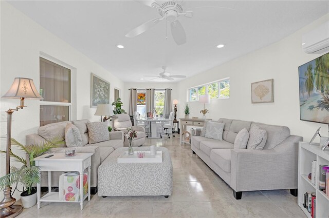 tiled living room with a wall unit AC and ceiling fan