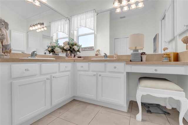 bathroom with tile patterned flooring, ornamental molding, and vanity