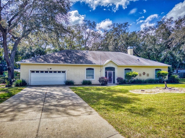 single story home featuring a front lawn and a garage