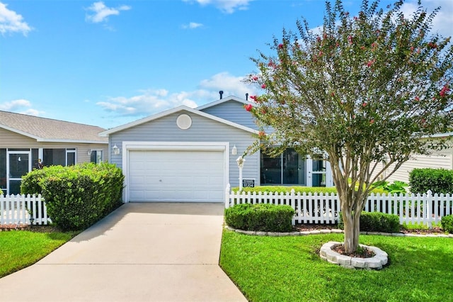 view of front of house featuring a garage and a front lawn