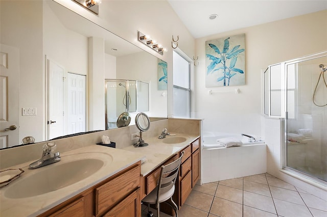 bathroom featuring independent shower and bath, vanity, and tile patterned floors