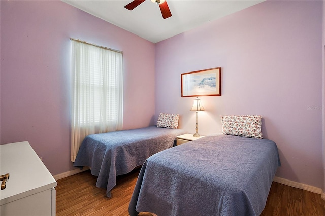 bedroom featuring ceiling fan and hardwood / wood-style floors