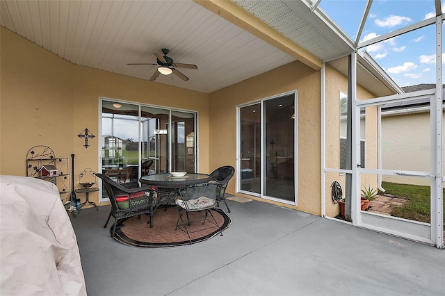 sunroom / solarium with ceiling fan