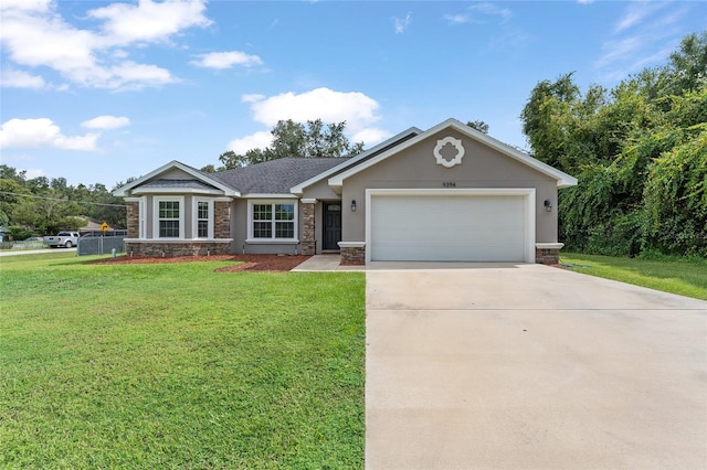 ranch-style home featuring a garage and a front yard