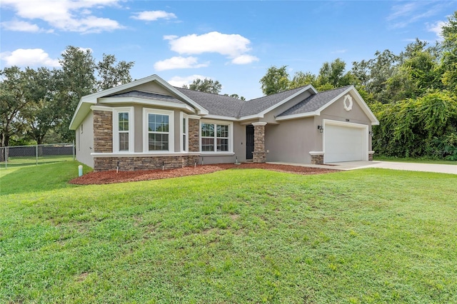 single story home with a garage and a front yard