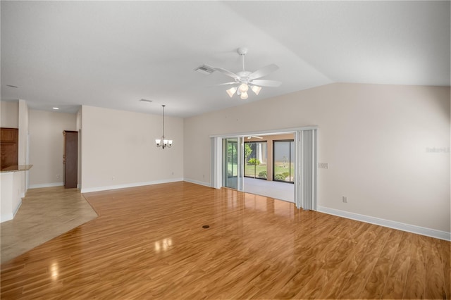 unfurnished living room featuring light hardwood / wood-style floors, lofted ceiling, and ceiling fan with notable chandelier