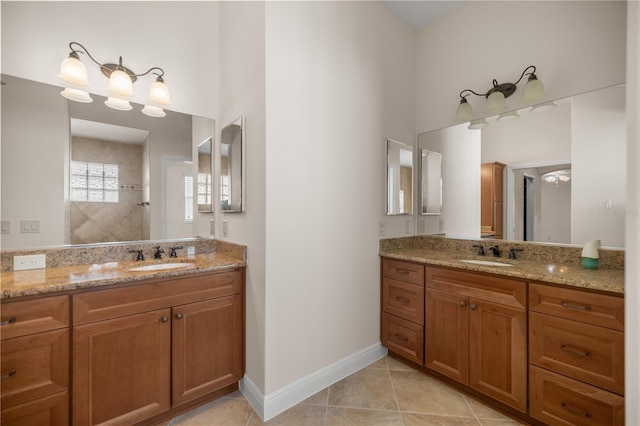 bathroom featuring vanity, walk in shower, and tile patterned flooring