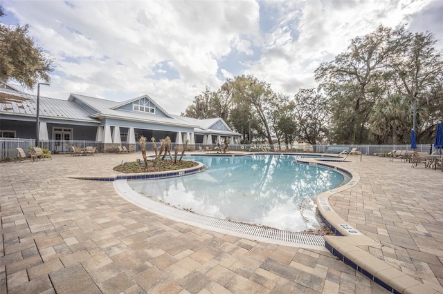 view of swimming pool with a patio area