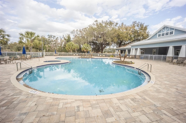 view of swimming pool featuring a patio