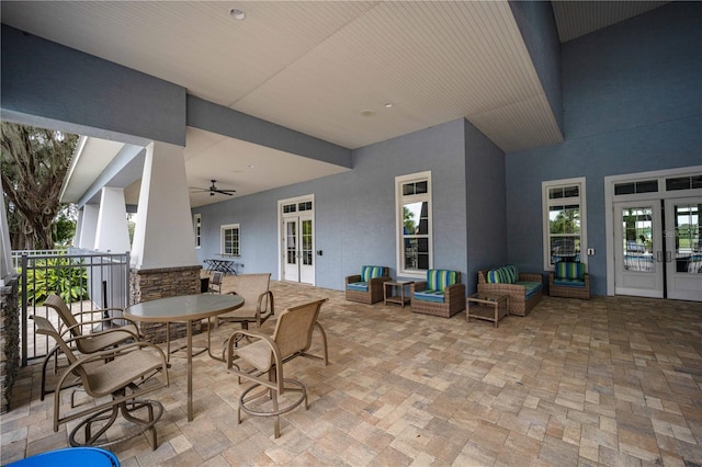 view of patio featuring ceiling fan and french doors