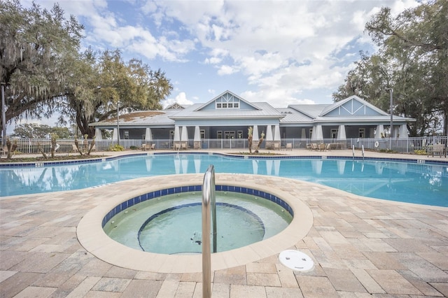 view of pool with a community hot tub