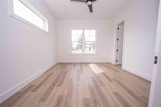 spare room with ceiling fan and light hardwood / wood-style flooring