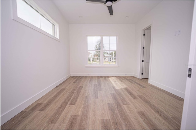 unfurnished room with light hardwood / wood-style flooring and ceiling fan