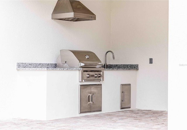 view of patio / terrace featuring area for grilling and an outdoor kitchen