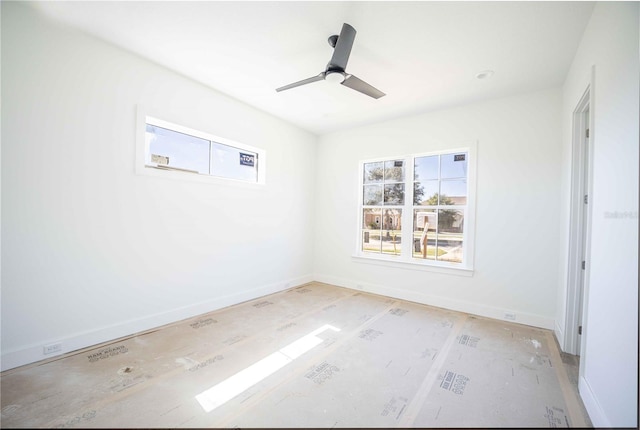 unfurnished room with ceiling fan