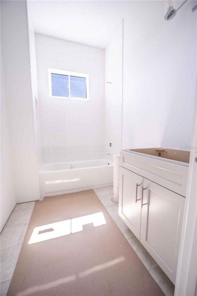 bathroom with tile patterned flooring, vanity, and shower / washtub combination