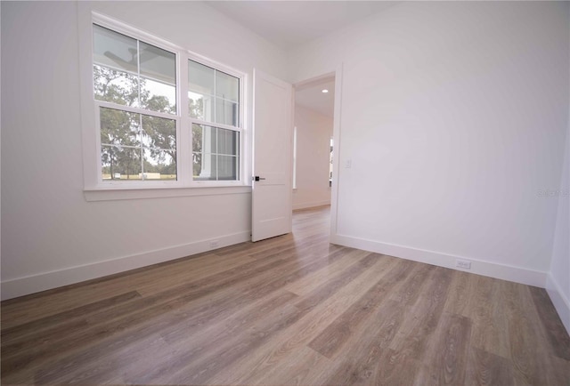 empty room with wood-type flooring