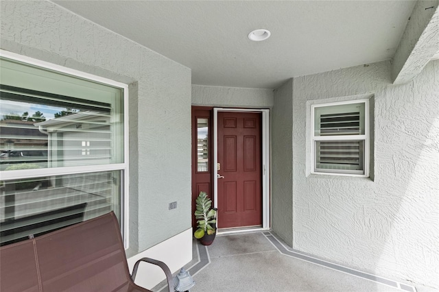 property entrance featuring stucco siding