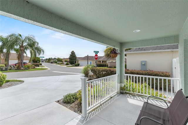 balcony featuring a residential view and a porch