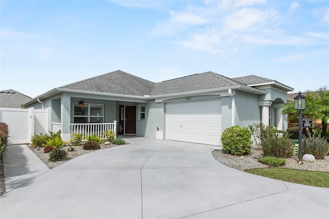 view of front of home featuring a garage and a porch