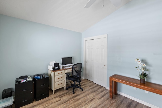 office area featuring ceiling fan, wood-type flooring, and lofted ceiling