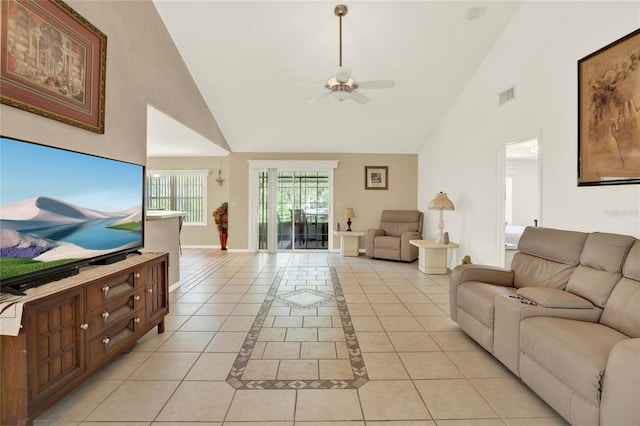 living room featuring visible vents, baseboards, light tile patterned floors, high vaulted ceiling, and a ceiling fan