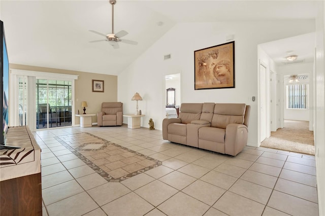 living area with light tile patterned floors, visible vents, high vaulted ceiling, and ceiling fan