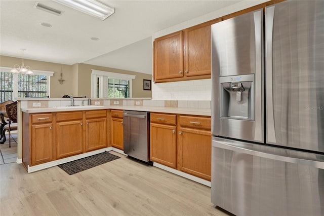 kitchen featuring light countertops, visible vents, appliances with stainless steel finishes, and a sink