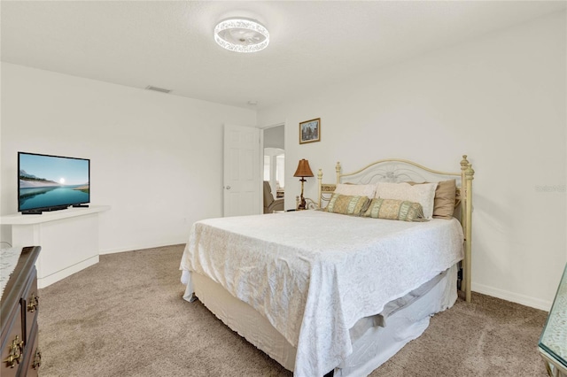 carpeted bedroom with baseboards