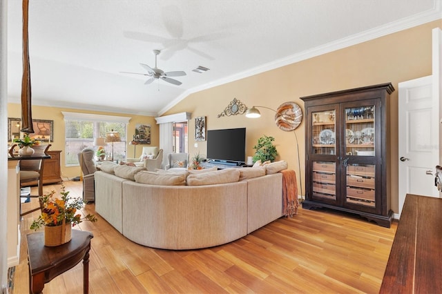 living room with crown molding, lofted ceiling, light hardwood / wood-style flooring, and ceiling fan