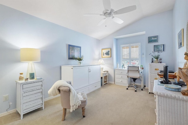 office space featuring ceiling fan, light colored carpet, and vaulted ceiling