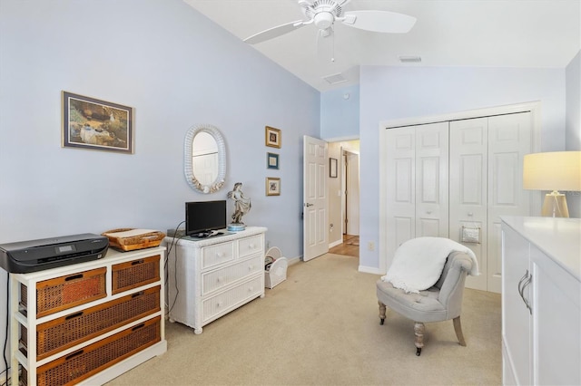 living area with light carpet, lofted ceiling, and ceiling fan