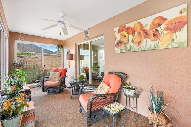 sunroom with ceiling fan