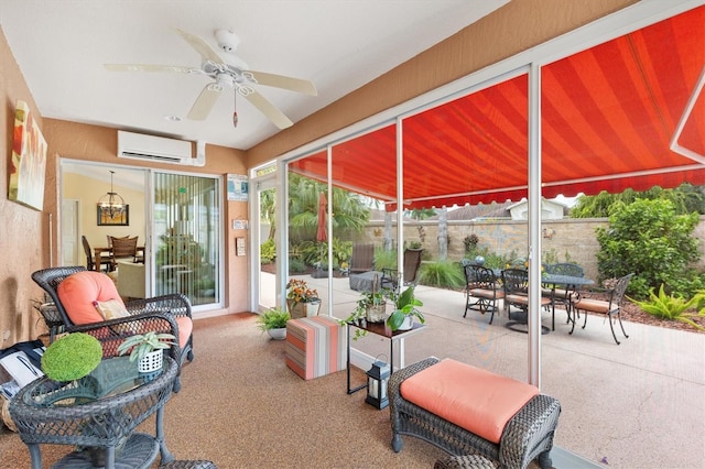 sunroom / solarium with a wall mounted AC and ceiling fan