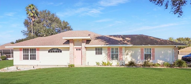 ranch-style home featuring a front yard