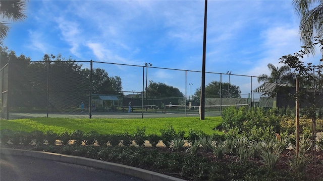 view of sport court with fence