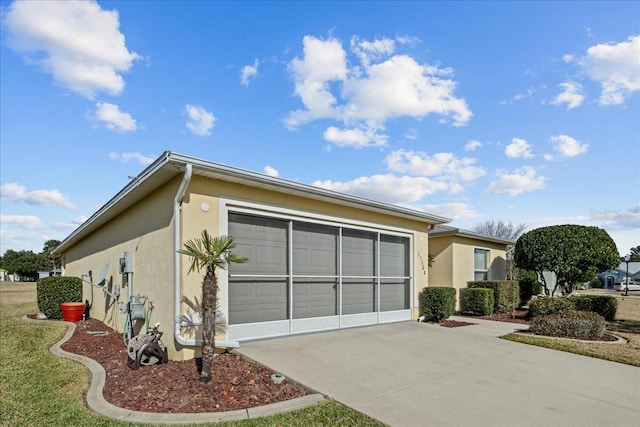 view of side of property with a garage