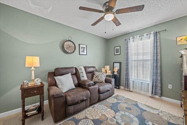 tiled living room featuring a textured ceiling and ceiling fan