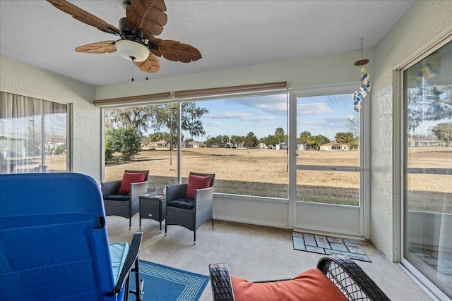 sunroom / solarium with ceiling fan