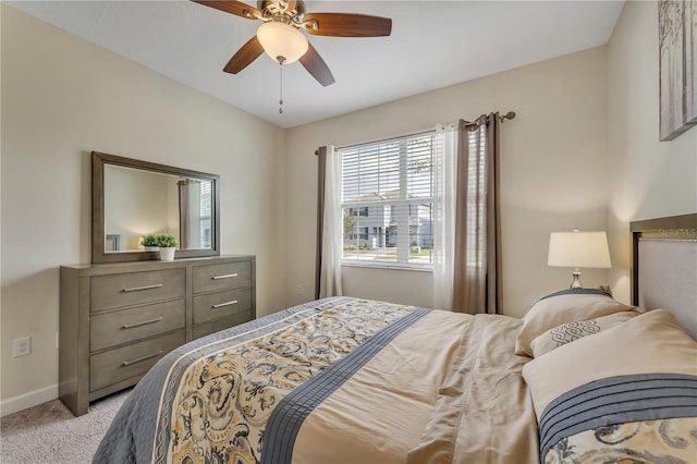 bedroom featuring ceiling fan and light colored carpet