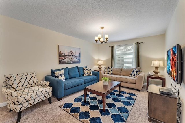 carpeted living room featuring a textured ceiling and a notable chandelier