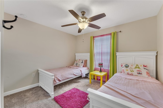 bedroom with ceiling fan and light carpet