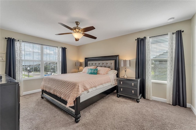 bedroom featuring a textured ceiling, carpet, and ceiling fan