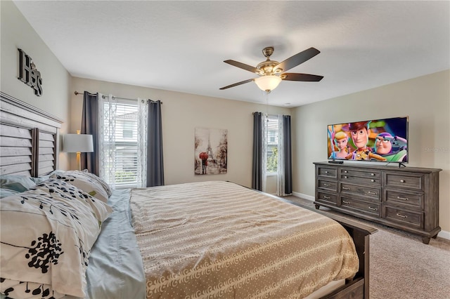 bedroom with ceiling fan and carpet