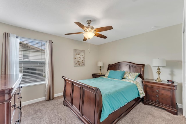 bedroom with light carpet and ceiling fan