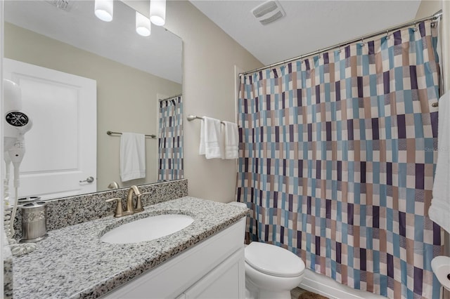 bathroom with a shower with curtain, toilet, and vanity