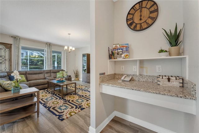 living room featuring hardwood / wood-style floors and a chandelier