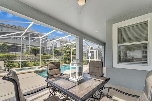 view of patio featuring glass enclosure and a pool with hot tub